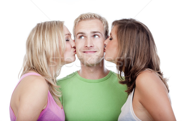 man being kissed by two girls Stock photo © courtyardpix