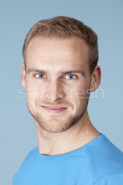 Portré fiatalember szőke haj izolált kék Stock fotó © courtyardpix