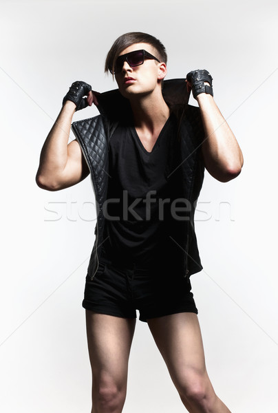 Young Man with Trendy Haircut and Sunglasses. Stock photo © courtyardpix
