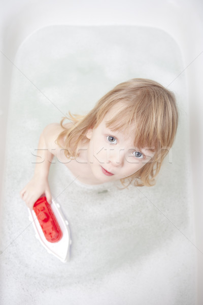 Ragazzo vasca da bagno lungo capelli giocare Foto d'archivio © courtyardpix