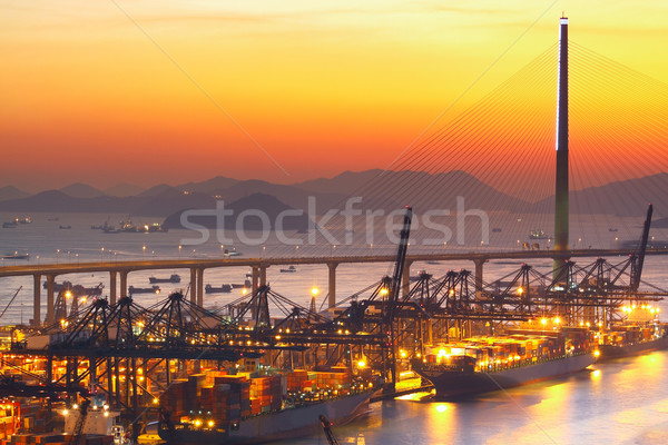 Port warehouse with cargoes and containers at sunset  Stock photo © cozyta