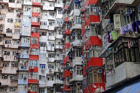 öreg lakások Hongkong nap épület világ Stock fotó © cozyta