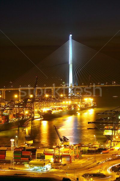 Port warehouse with cargoes and containers at night Stock photo © cozyta