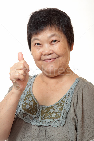 Gelukkig asian jonge vrouw geven uitstekend gebaar Stockfoto © cozyta
