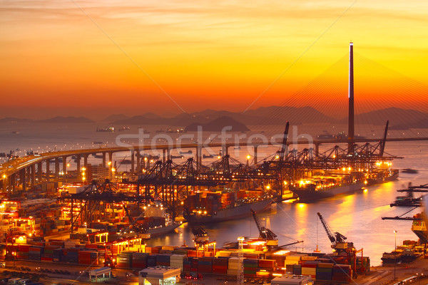 Port warehouse with cargoes and containers at sunset  Stock photo © cozyta