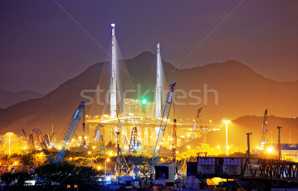 Stock photo: Container Cargo freight ship with working crane bridge