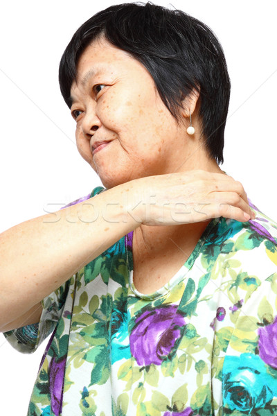 senior woman holding her aching back  Stock photo © cozyta