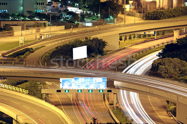 Freeway in night with cars light in modern city.  Stock photo © cozyta