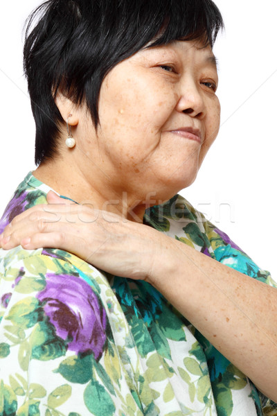 senior woman holding her aching back  Stock photo © cozyta