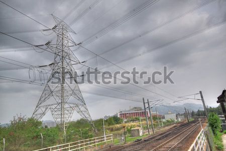 passenger trains in motion and power tower on background  Stock photo © cozyta