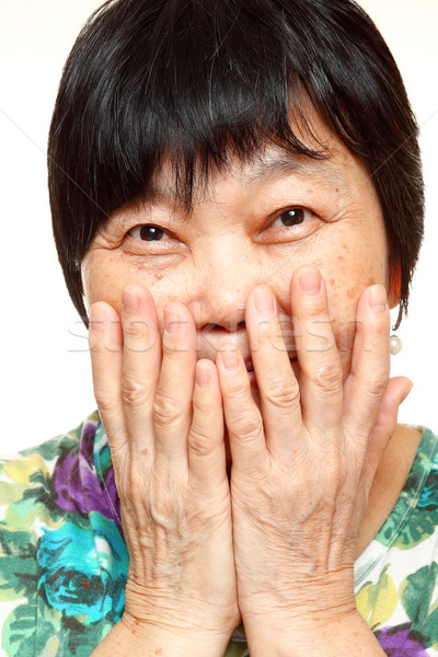 asian woman use hand cover her mouth Stock photo © cozyta