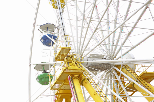 ferris wheel against a blue sky Stock photo © cozyta