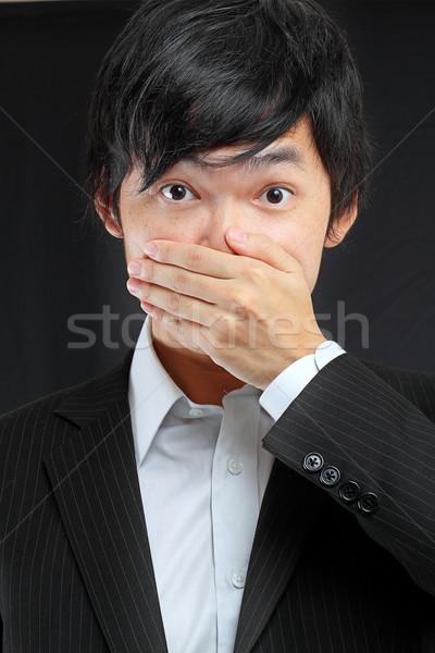 scared adult man with hand covering mouth  Stock photo © cozyta