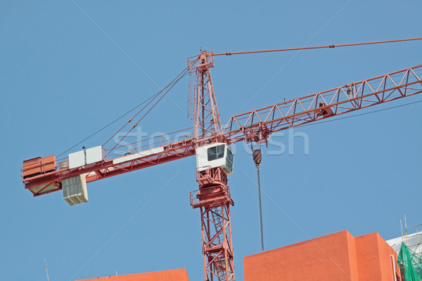Construction crane at the construction site, on a cloudless sky  Stock photo © cozyta