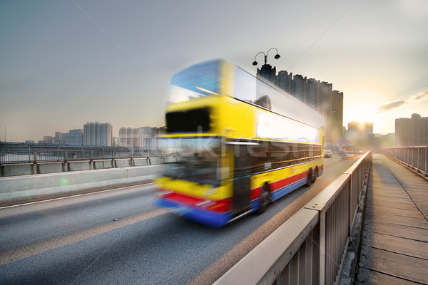 Sebesség busz naplemente út üzlet égbolt Stock fotó © cozyta