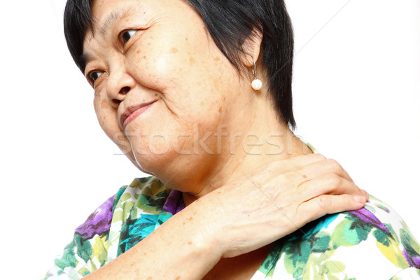senior woman holding her aching back  Stock photo © cozyta