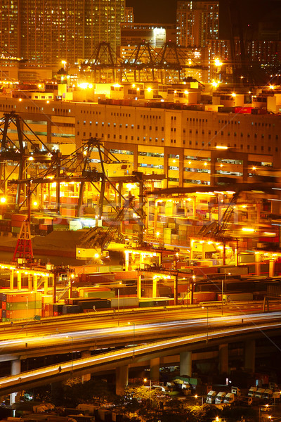 Port warehouse with cargoes and containers at night Stock photo © cozyta