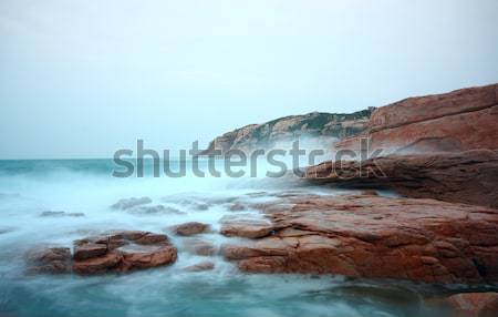 rocky sea coast and blurred water in shek o,hong kong  Stock photo © cozyta