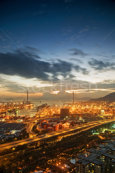 Port warehouse with cargoes and containers at night  Stock photo © cozyta