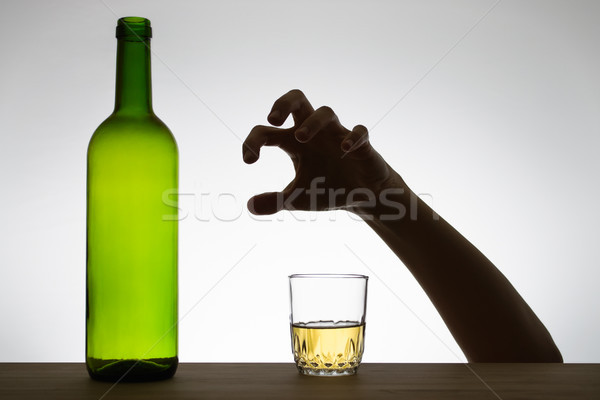 Hand reaching for a glass of wine Stock photo © CsDeli