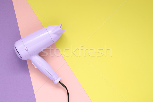 Purple hair dryer on colorful paper background Stock photo © CsDeli
