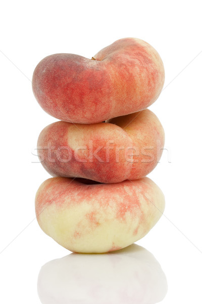 Saturn or donut peaches isolated on white background Stock photo © CsDeli
