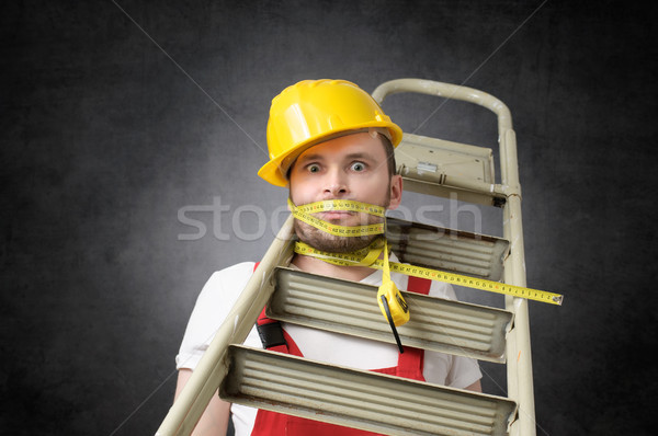 Stockfoto: Onhandig · werknemer · bouwvakker · ladder · gebouw