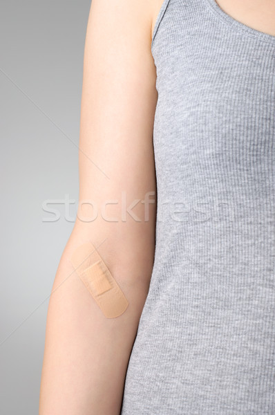Plaster on female arm Stock photo © CsDeli