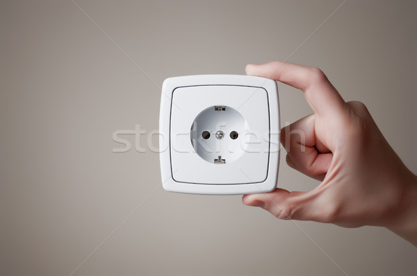 Hand with electric outlet Stock photo © CsDeli