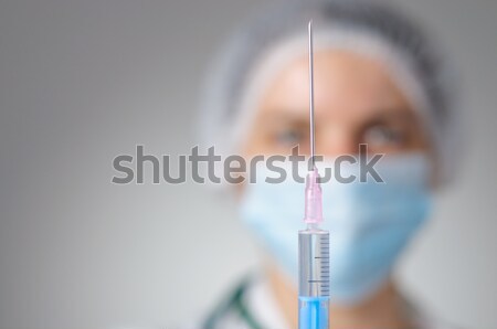 Female doctor with syringe Stock photo © CsDeli