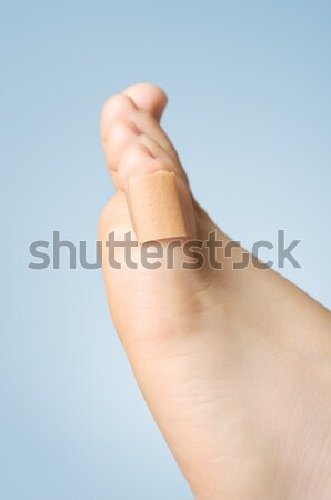 Closeup of a plaster on female toe Stock photo © CsDeli