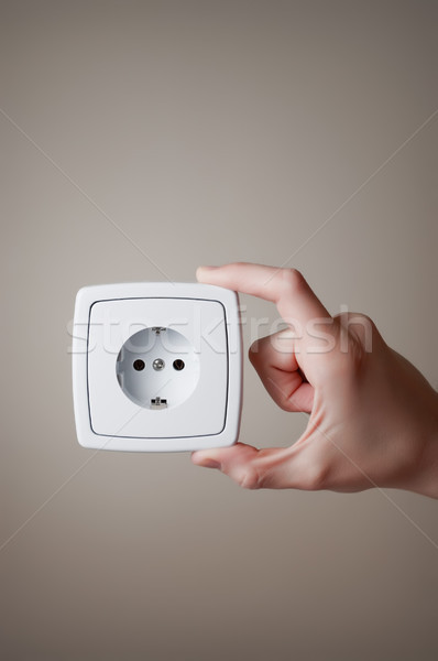 Hand with electric outlet Stock photo © CsDeli