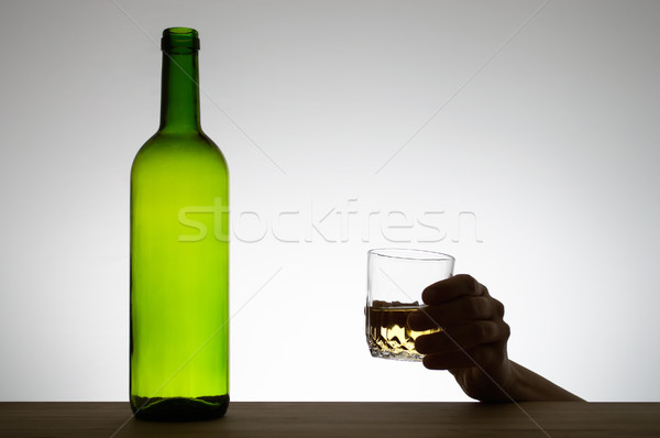 Hand holding a glass of wine Stock photo © CsDeli