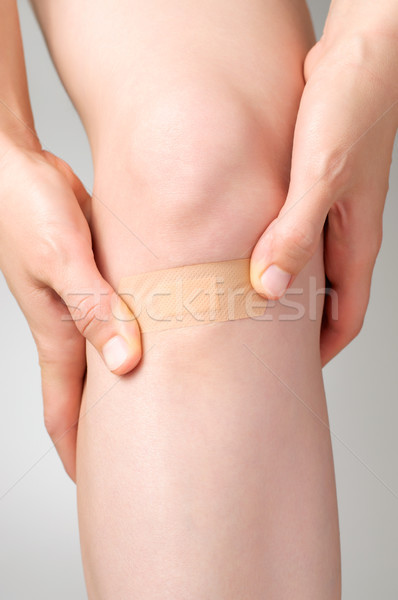 Plaster on female leg Stock photo © CsDeli