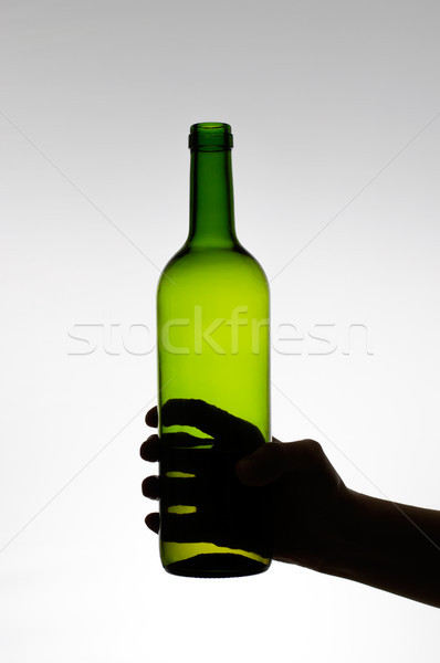 Foto stock: Femenino · mano · botella · silueta · verde