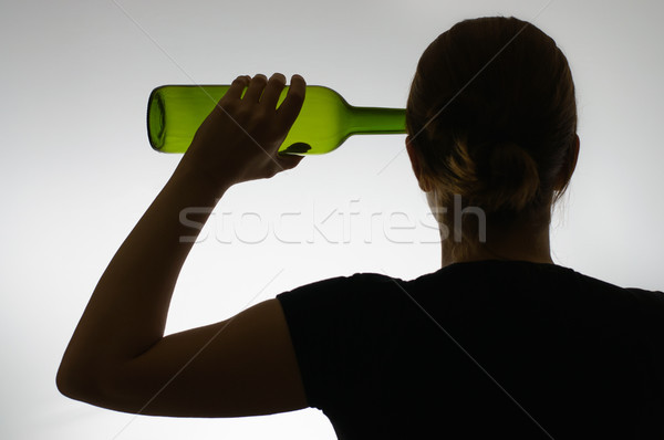 Silhouette of an alcoholic with a bottle Stock photo © CsDeli