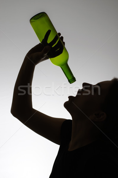 Silhouet vrouw fles lege wijnfles meisje Stockfoto © CsDeli