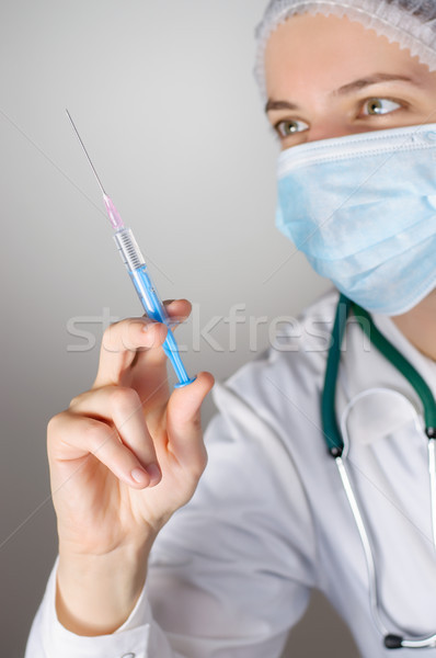 Stock photo: Female doctor with syringe