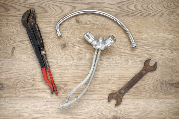 Old plumbing tools and tap on wooden background Stock photo © CsDeli