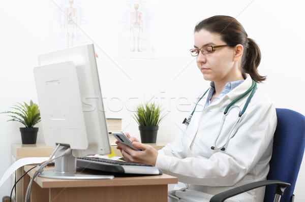 Portrait of a doctor using smartphone Stock photo © CsDeli
