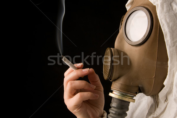 Személy gázmaszk dohányzás cigaretta sötét biztonság Stock fotó © ctacik