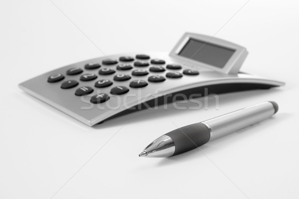 Stock photo: Pen and calculator