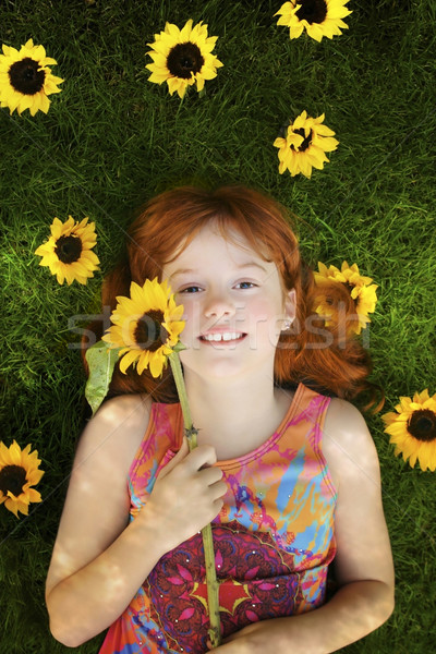 Kleines Mädchen Sonnenblumen wenig rot Mädchen Verlegung Stock foto © curaphotography