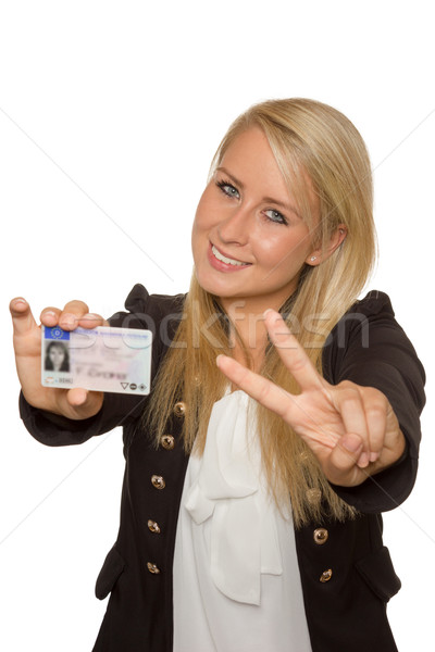 Young woman showing her driver's license Stock photo © Cursedsenses