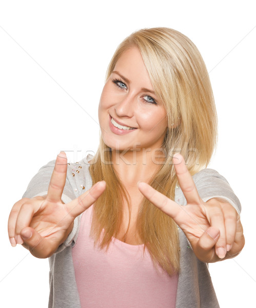 Young woman showing peace sign with her hands Stock photo © Cursedsenses