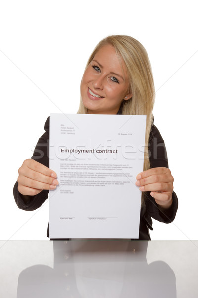 Happy young woman is happy about her employment contract Stock photo © Cursedsenses