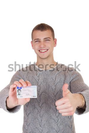 Young man showing his driver license Stock photo © Cursedsenses