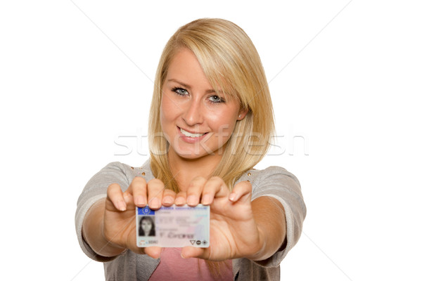 Young woman showing her driver's license Stock photo © Cursedsenses
