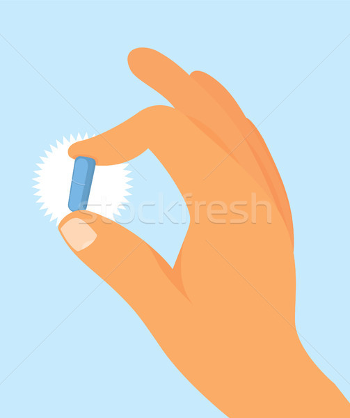 Hand holding blue pill Stock photo © curvabezier