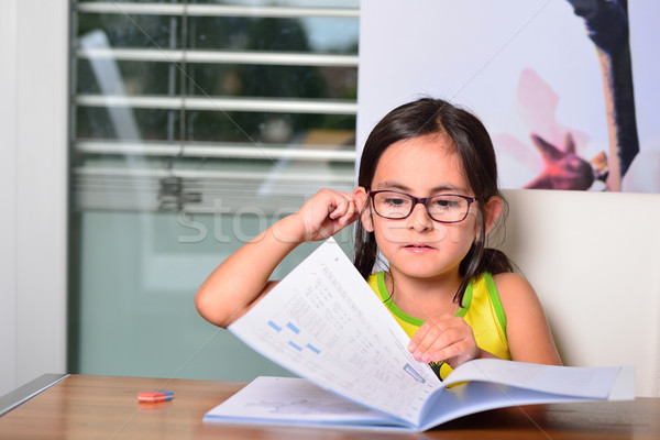 Little cute girl doing homework Stock photo © cwzahner